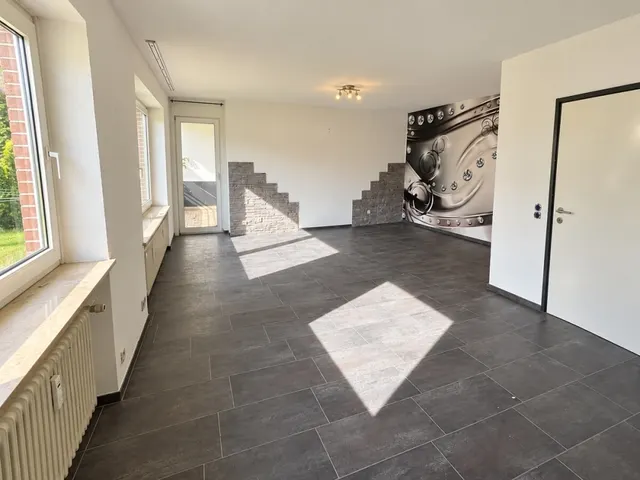 Wohnzimmer mit Zugang zur Loggia